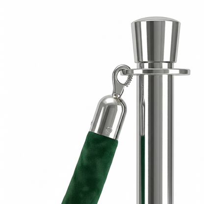 Close-up of a green umbrella handle with silver metal parts on a white background