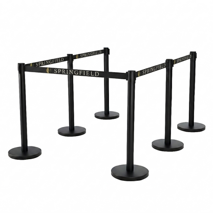 A set of black retractable queue barriers with gold 'SPRINGFIELD' branding on the belts, shown on a solid white background.